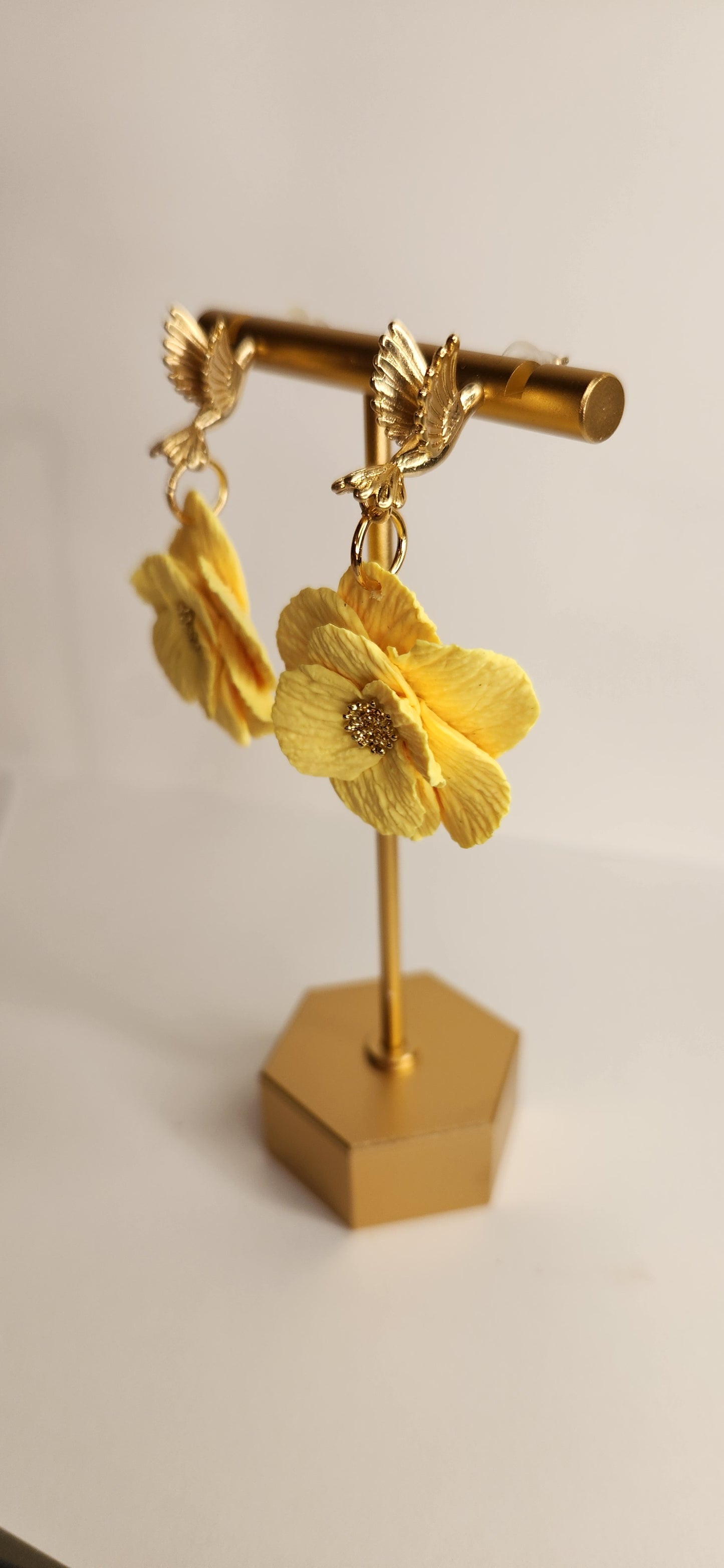Gold Hummingbird with Yellow Flower