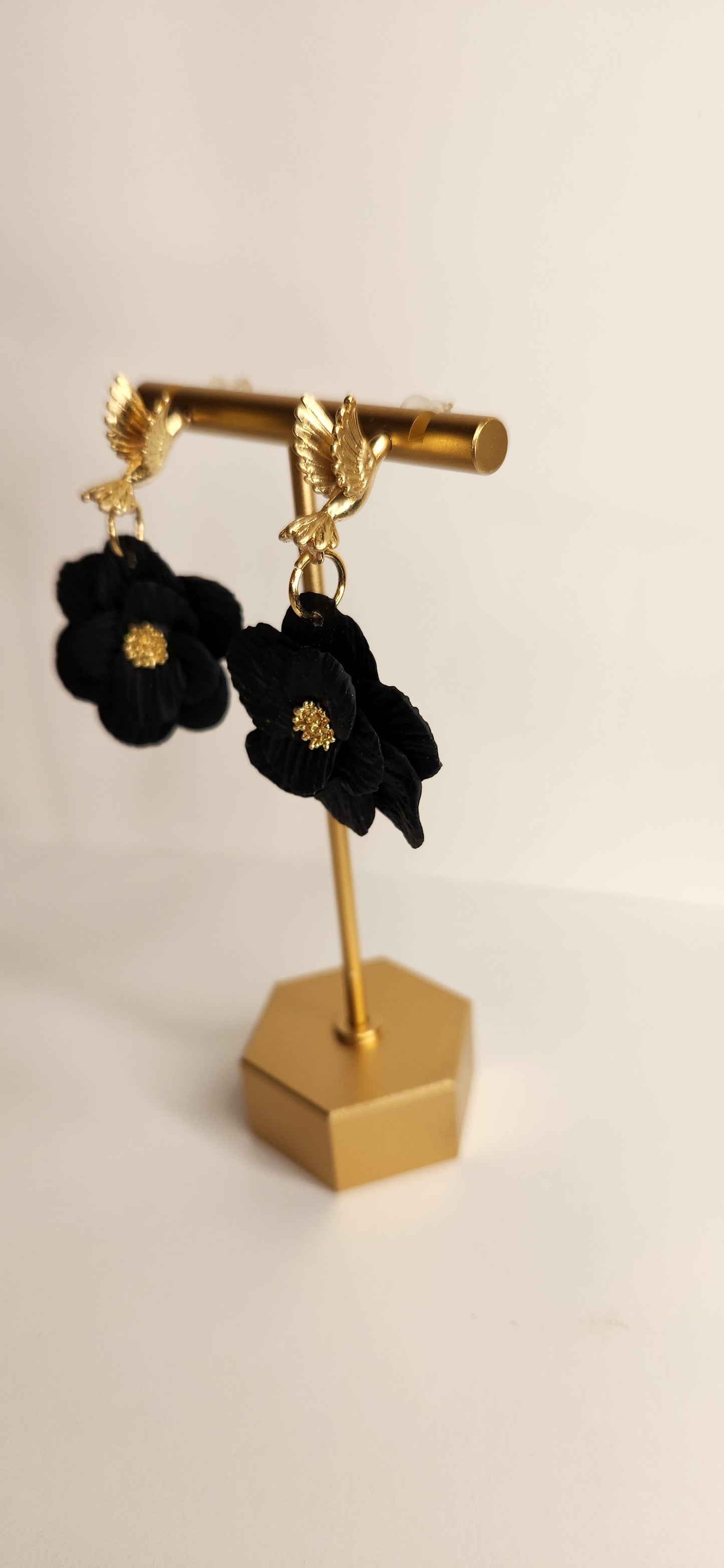 Gold Hummingbird with Black Flower